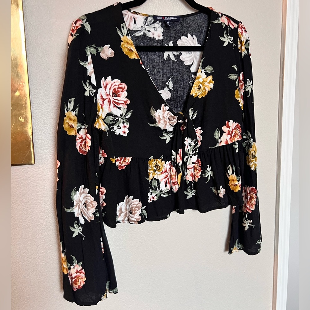 Black floral long sleeve crop top - relaxed fit, ruffle bottom with tie front